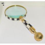 Large brass and checker board magnifying glass