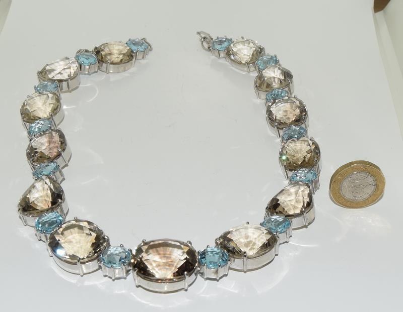 Large silver and smokey quarts with blue topaz necklace