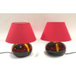 Poole Pottery pair of table lamps with red shades.
