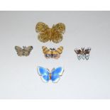 Art Deco silver and enamel butterfly brooch together with four other butterfy brooches.