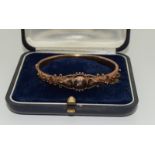 A Victorian Diamond set 9ct Gold Bangle.