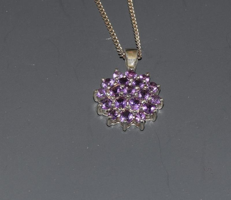 An Amethyst daisy cluster 925 silver Pendant.