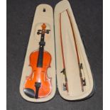 A good students violin in a case with twin bows .