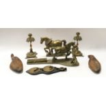 A quantity of brass ware to include horse ornaments, horse brasses, vintage shoe stretchers and