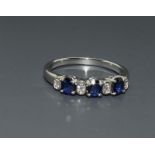 A quality Sapphire half eternity 925 silver ring, Size T.