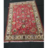 Tabriz room size carpet in red and cream. 315x220