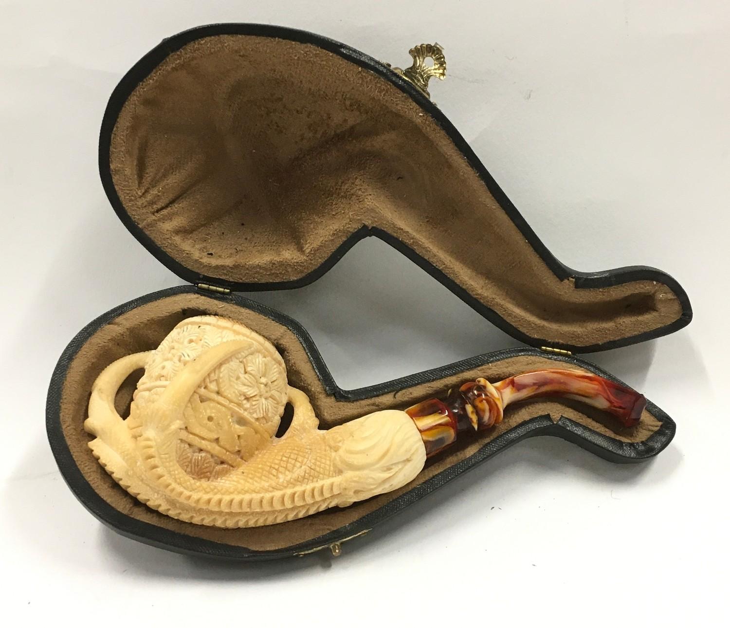 Cased Meerschaum pipe depicting a bird claw a/f