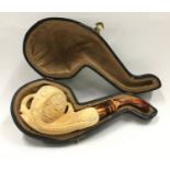 Cased Meerschaum pipe depicting a bird claw a/f