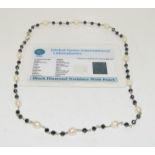 Black diamond and pearl on silver necklace with certificate