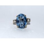 Gold on silver blue topaz CZ ring. Size Q.