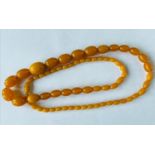 Antique amber necklace, 90cm in length , weight 78g.