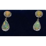 Pair 18ct white gold Fiery opal drop earrings with some diamond surrounds, drop 2.5cm ,1cm round