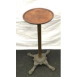 A wine table based on a cast iron base with brass support and round mahogany top 67x50x38cm