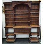 An Arts & Crafts oak two part dresser with adjustable shelves (H: 237, W:205, D:44cm).