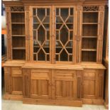 Solid pine two part break front dresser with turned decoration and carved motifs ,twin glazed