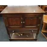 Small oak sideboard with linen fold pattern to front.