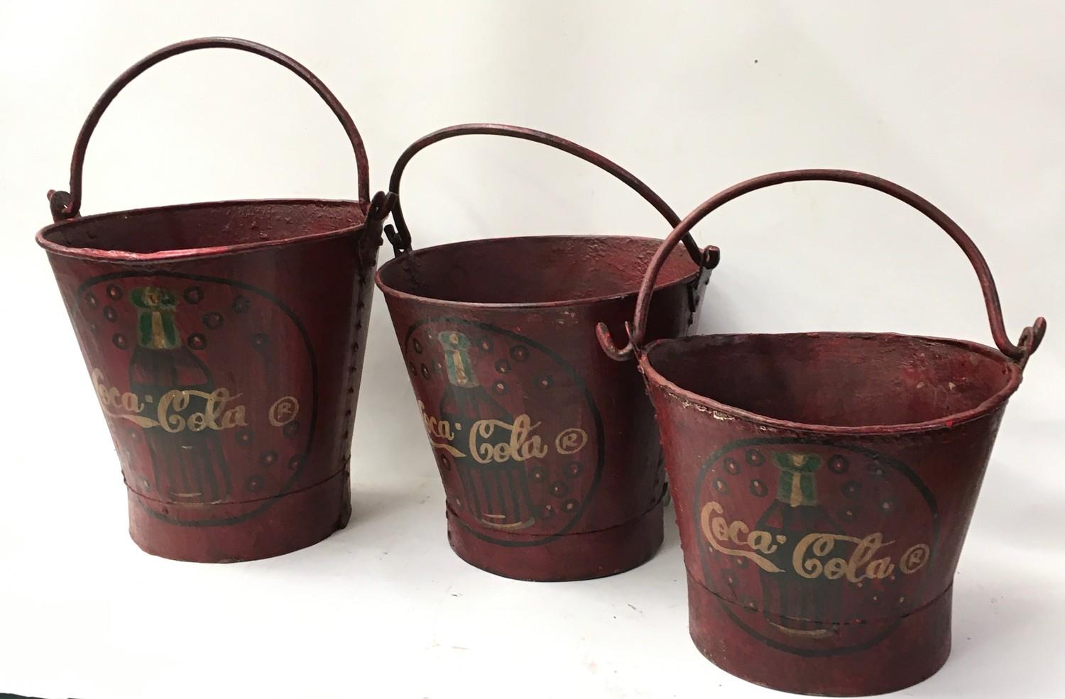 A set of three Coca Cola buckets . Ref 253