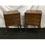 Pair of walnut bedside tables on cabriolet legs