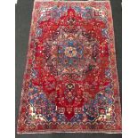 Mashad rug in medallion blue and red. 215x140