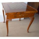 Mahogany games table with lift out center for other games and usage standing on cabriole legs with
