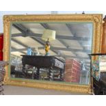 Large gilt surround over mantle picture mirror with ornate gilt decoration 180x130cm