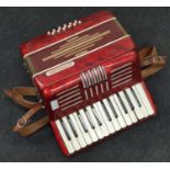 Vintage "Accordiana" red accordion.