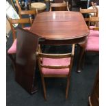 Wind out mahogany extending table on claw feet with set of 6 regency style chairs