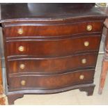 Mahogany 4 draw chest of drawers of small proportions and serpentine front with brass ring pull