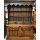 Large dark oak solid dresser with two shelves and three spice drawers to top section and two