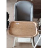 A Vintage high chair with grey leather seat.