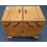 Vintage cantilever sewing cabinet on castors.