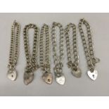 6 silver bracelets with heart locks and safety chains