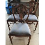 Three hepplewhite style dining chairs.