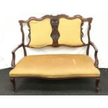 Mahogany 2 seat parlour settee with carved show wood surrounds set on splayed legs with castors