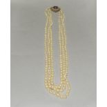 Triple strand Cultured Pearls Amethyst Seed Pearls.set with a gold and amethyst clasp