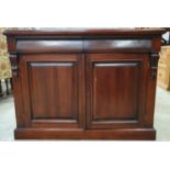 Solid mahogany sideboard fitted with two cutlery drawers above a double width cupboard. Decorative