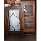 Edwardian mahogany display case of smaller proportion together with another with adjustable shelves.