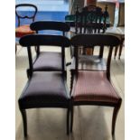 A harlequin set of four dining chairs.