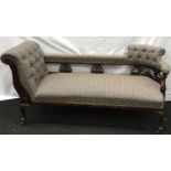 Mahogany Victorian show wood surround twin seat chaise longue with carved centre and castors