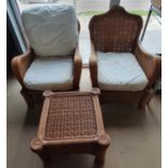 Two conservatory chairs and a matching side table.