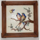 Minton large tile framed with feet so can be used as trivet, relief moulded depicting two