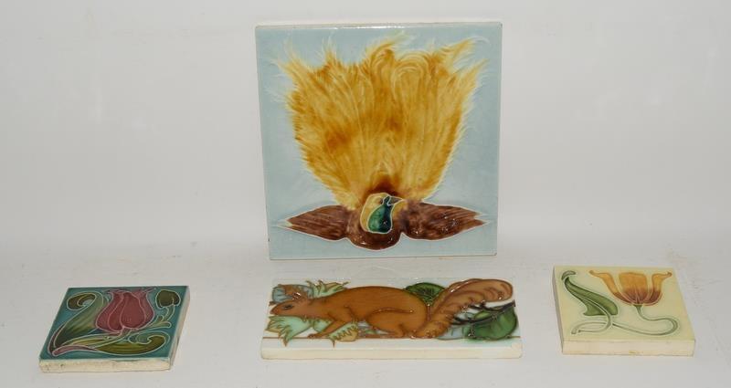 Richards England embossed tile depicting a bird 6" x 6" together with two small tiles depicting