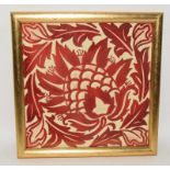 Lewis Day ruby lustre ware tile depicting a stylized flower / artichoke in gold frame 6.6" x 6.