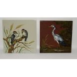 Minton Hollins large handpainted slip clay tile depicting a stork (restored) together with one other