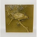 Burmantofts large Faience relief moulded tile depicting a Russian Dove on pine branch, formed on