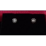 Pair of 14ct white gold diamond stud earrings of approx 0.5ct