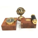 Contemporary brass cased compass brass cased telescope and a brass horilogical world