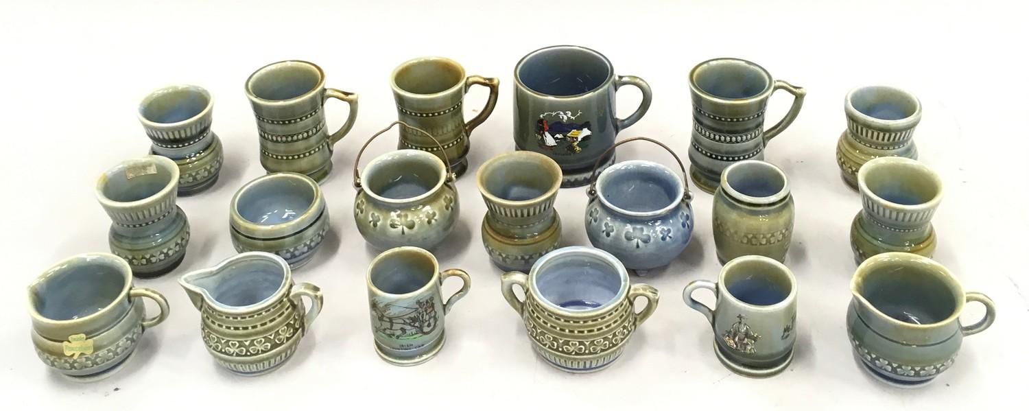 A quantity of Wade miniatures to include mugs, jugs etc.