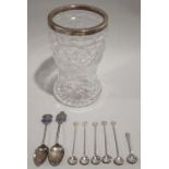 Collection of eight small silver spoons together with a silver rimmed crystal glass vase.