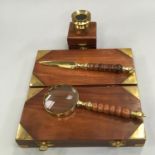 Contemporary brass letter opener and cased magnifying glass together with a brass eyepiece magnifier